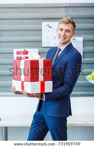 A young man in the office receives a gift