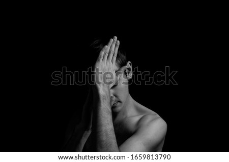 Similar – depressed man closes his eyes with his hands