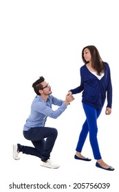 Young Man On His Knees Proposing To Unimpressed Girl Isolated On White