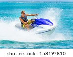 Young Man on Jet Ski, Tropical Ocean, Vacation Concept