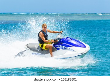 Young Man On Jet Ski, Tropical Ocean, Vacation Concept