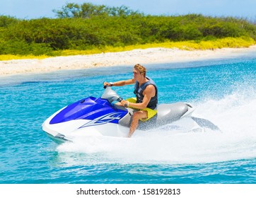 Young Man On Jet Ski, Tropical Ocean, Vacation Concept