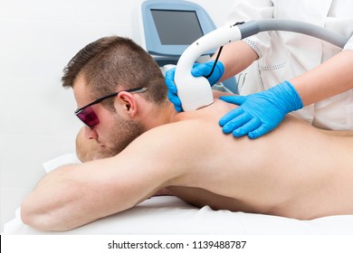 A Young Man On A Procedure Of Laser Hair Removal In The Salon Of Aesthetic Beauty.