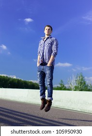 YOung Man On A Road Levitating