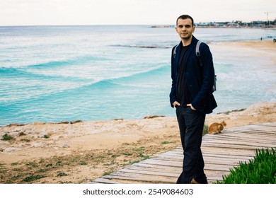 young man on rocky coast with turquoise water of Ayia Napa, Cyprus - Powered by Shutterstock