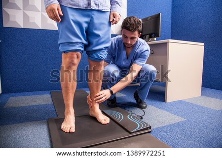 Young man on study of the tread in a podiatry cabinet Zdjęcia stock © 