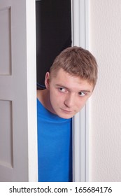 Young Man Opening Door.