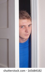 Young Man Opening Door.