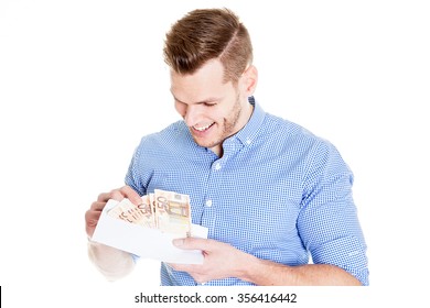 Young Man Opening Envelope With Money