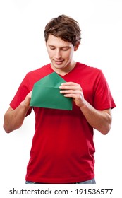 Young Man Opening Letter In Green Envelope