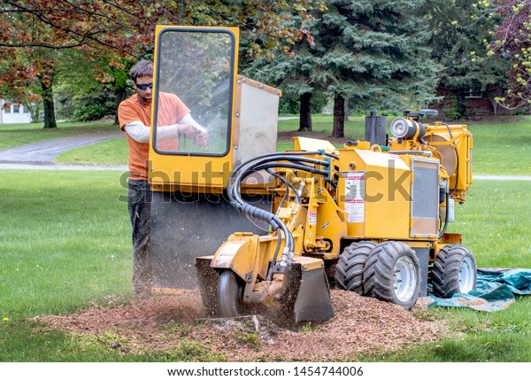 Young Man Operates Stump Grinder Machine Stock Photo Edit Now 1454744006