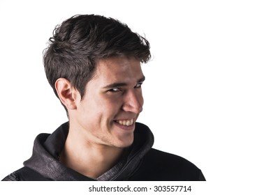 Young man outdoor doing silly face and stupid expression, turning to a side, isolated on white