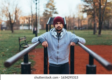 Young Man Outdoor Workout In Outdoor Gym