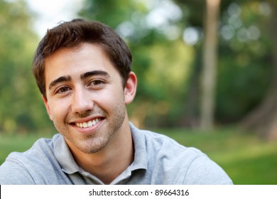 Young man outdoors portrait with copy space