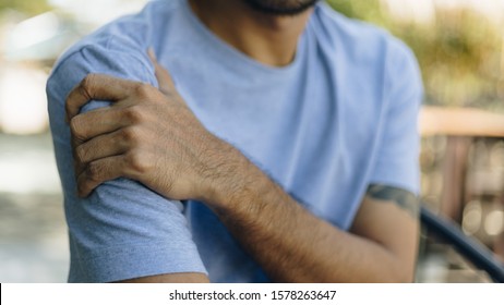 Young Man With Pain In Shoulder And Upper Arm ,health Care Concept