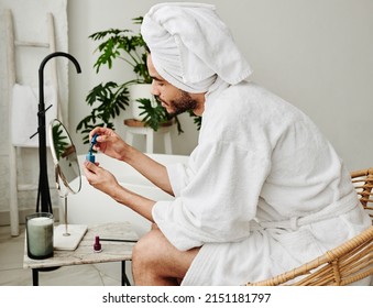 Young Man Painting His Nails