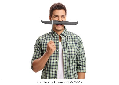 Young Man With A Pair Of Fake Moustache Isolated On White Background