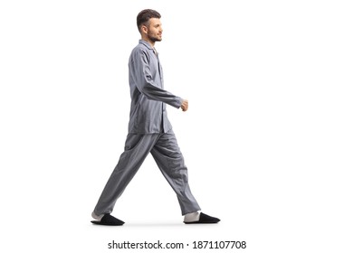 Young Man In Pajamas Walking Isolated On White Background