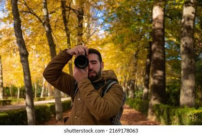 Young Man Photographer With His Camera