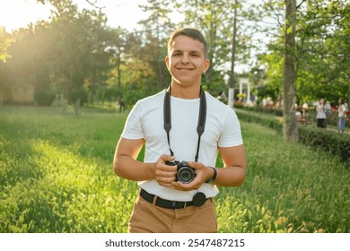 Young Man Photographer, Traveler taking photo with his camera. - Powered by Shutterstock