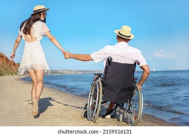 Young man with physical disability and his girlfriend at sea resort - Powered by Shutterstock