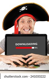 Young Man In Pirate Costume And Computer Laptop Representing Illegal Downloads, Movies And Music Downloading And Copyright Violation Isolated On White Background