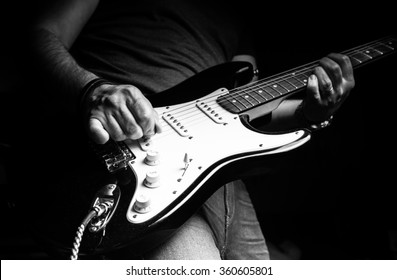 Young man playing electric guitar. Music, instrument education, entertainment, rock star, music concert   and learning concept
