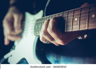 Young Man Playing Electric Guitar. Music, Instrument Education, Entertainment, Rock Star, Music Concert   And Learning Concept