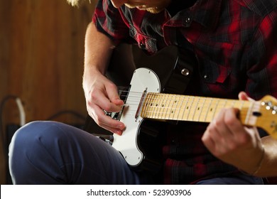 Young Man Playing Electric Guitar.