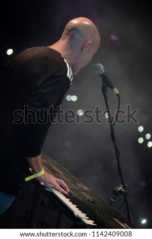 young man playing electronic keyboard.