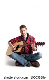 Young Man Playing Guitar Against White Background.