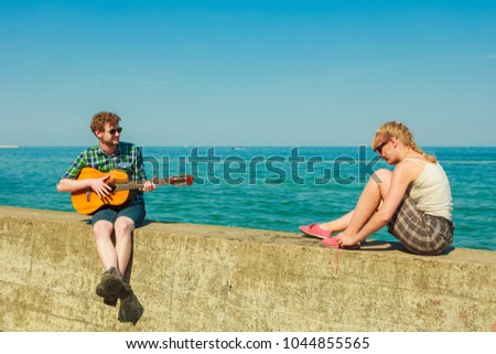 Similar – Young musician enjoying guitar on sunny day