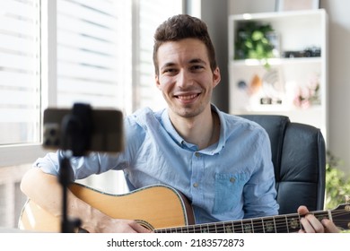 Young Man Playing Guitar, Musician Artist Recording New Song, Making Music In Home Studio, Using Laptop, Teacher Holding Online Lesson