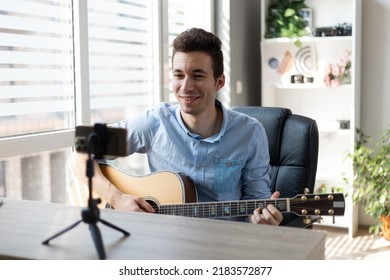 Young Man Playing Guitar, Musician Artist Recording New Song, Making Music In Home Studio, Using Laptop, Teacher Holding Online Lesson