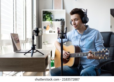 Young Man Playing Guitar, Musician Artist Recording New Song, Making Music In Home Studio, Using Laptop, Teacher Holding Online Lesson