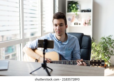 Young Man Playing Guitar, Musician Artist Recording New Song, Making Music In Home Studio, Using Laptop, Teacher Holding Online Lesson