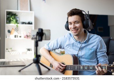 Young Man Playing Guitar, Musician Artist Recording New Song, Making Music In Home Studio, Using Laptop, Teacher Holding Online Lesson