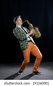 Young Man Playing The Saxophone 