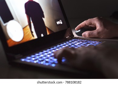 Young Man Playing Video Game With Laptop. Gamer With Computer In Dark Or Late At Night. Hands On Mouse And Keyboard. Competitive Gaming, Electronic Sports And Esports.