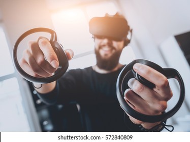The young man plays a game at the office. Virtual reality