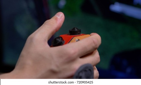 Young Man Plays Video Game With A Retro Joystick. Gaming Joystick From The Mid-1980s. Computer Joystick With Hand