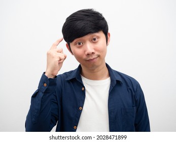 Young man point finger at his head gesture thinking portrait white background - Powered by Shutterstock