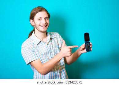 Young man pointing to mobile phone