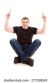 young man pointing up, white background