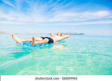 Young Man With Pool Raft