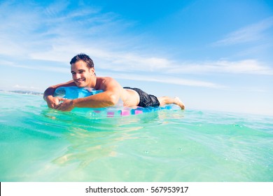Young Man With Pool Raft