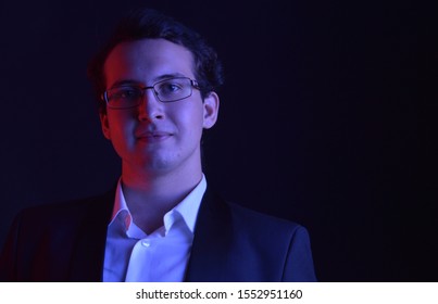 Young man portrait in color light