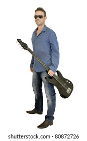 Young man posing with a guitar