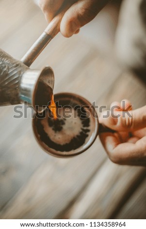 Similar – Senior Paar Hände gießen Kaffee aus der Thermoskanne.