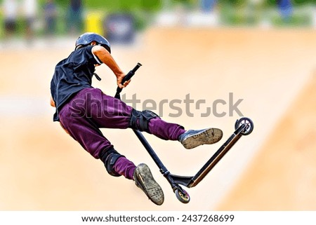 Young man practicing Scootering (Freestyle Scootering) in the new SkatePark in the central park of Igualada, Barcelona, Spain. blurred background